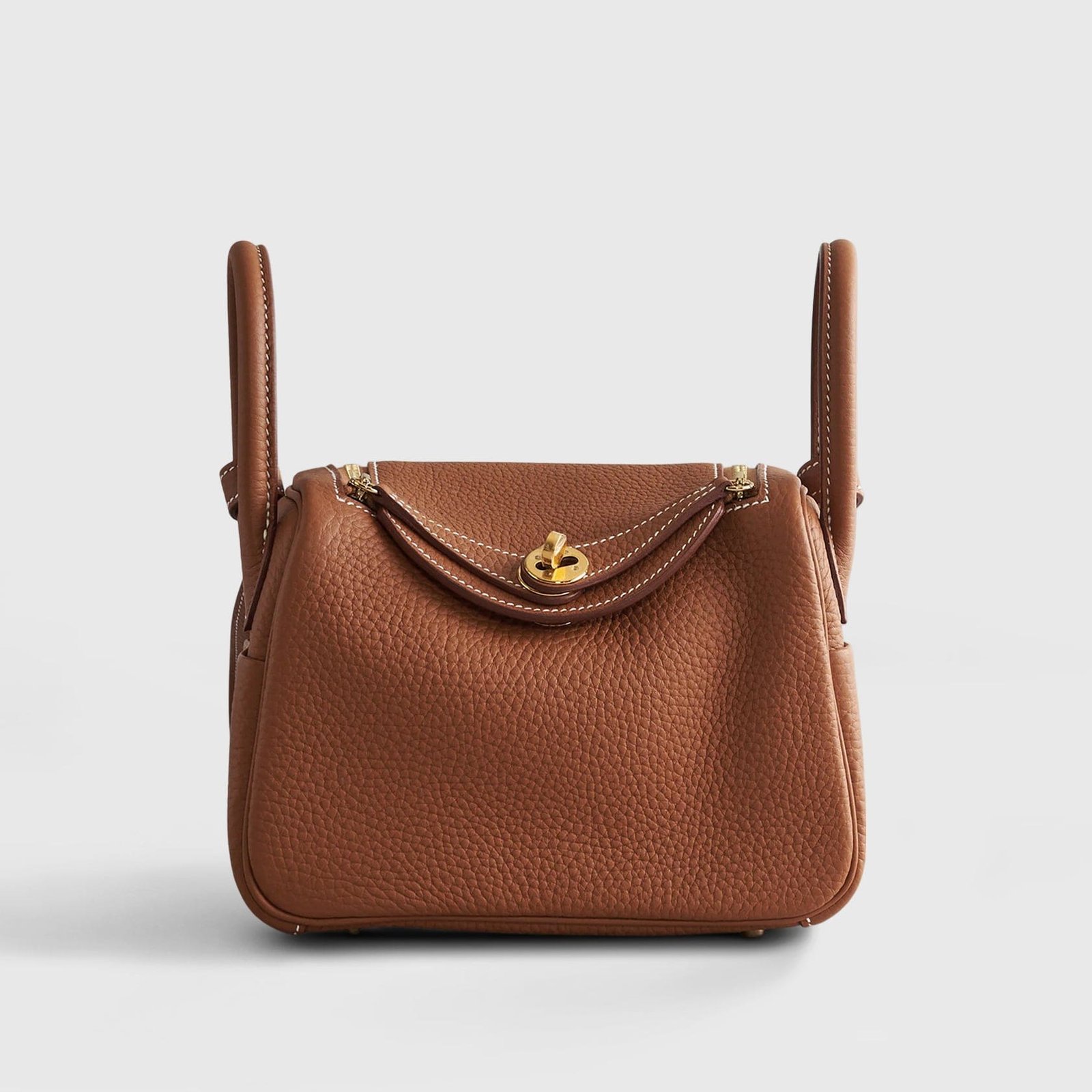 201HermesLindy20ClemenceGoldGoldHardware.jpg Hermès Lindy 20 Clemence Gold Gold Hardware - Image 1