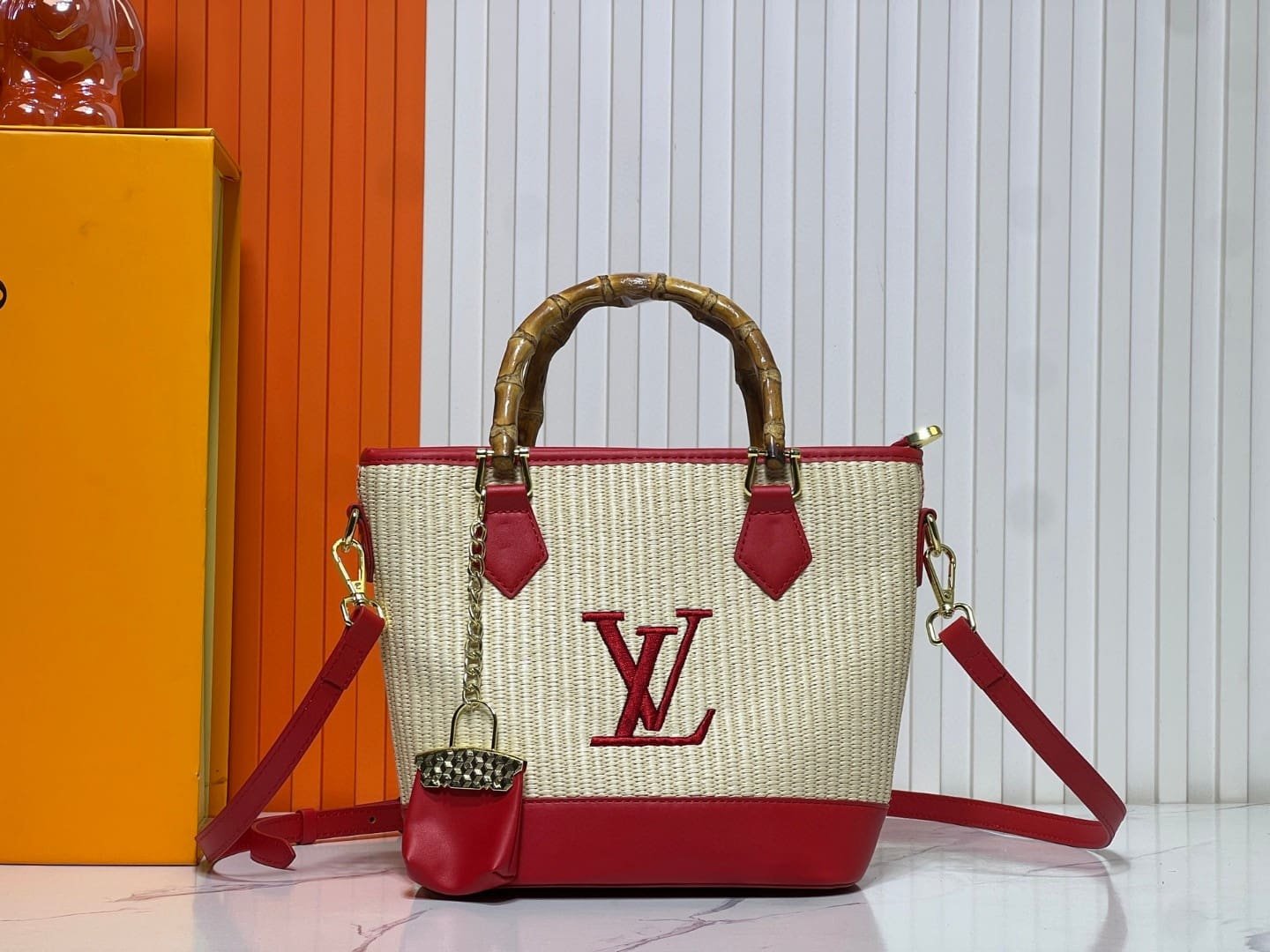 97b32484c24115756b347a0dc0c8992c.jpg Louis Vuitton Raffia Petit Bucket Tote - Image 1